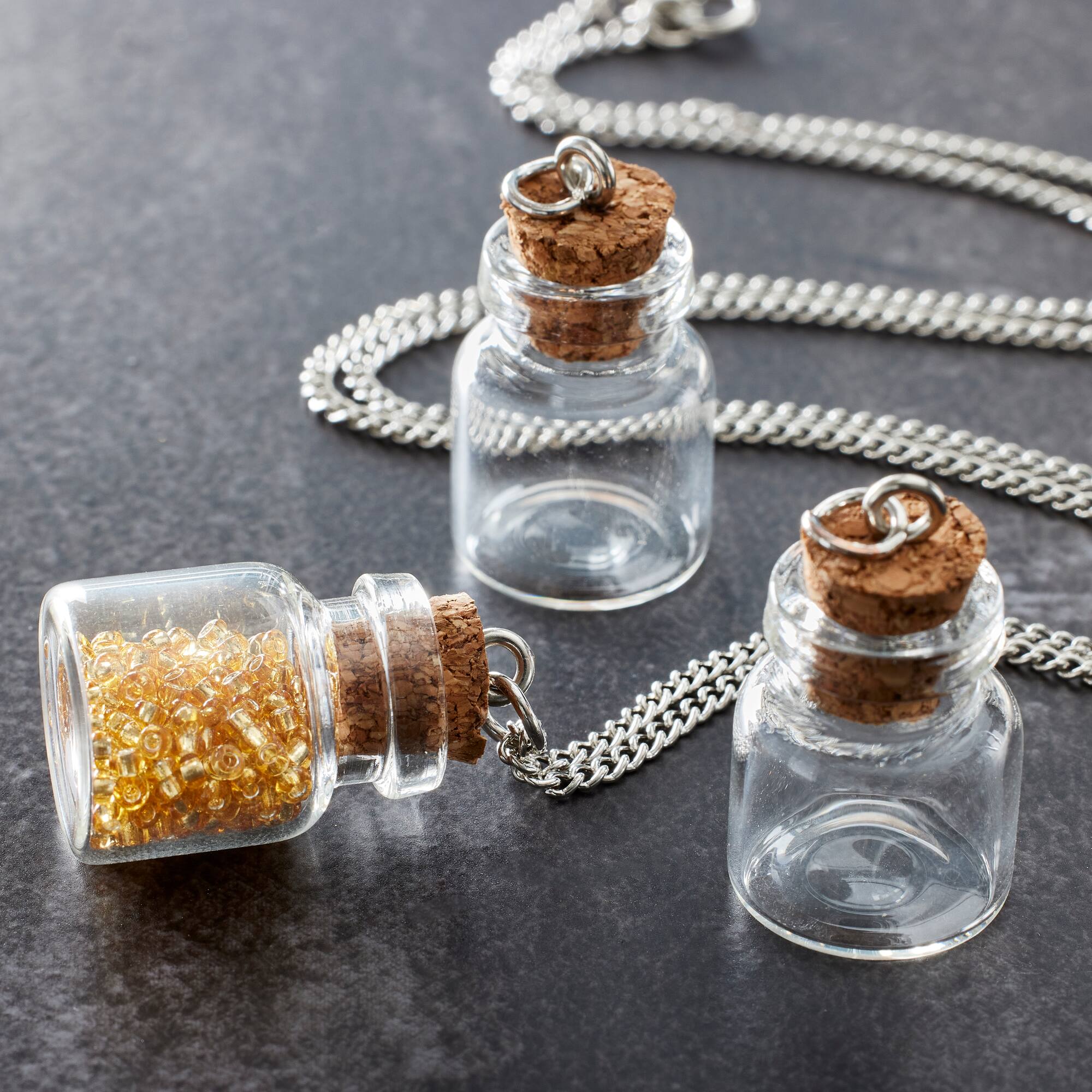 12 Packs: 3 ct. (36 total) Found Objects™ Clear Bottles by Bead Landing™